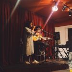 Two musicians performing on stage at a Shine Music School jam session at Sala Or in Gracia, Barcelona