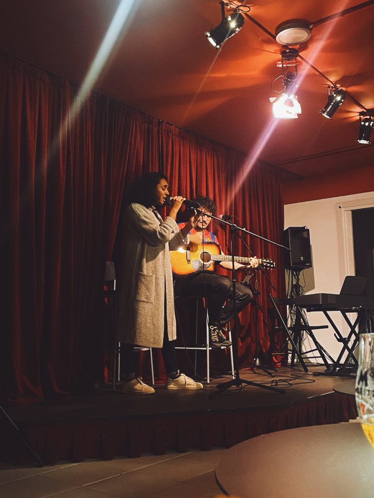 Two musicians performing on stage at a Shine Music School jam session at Sala Or in Gracia, Barcelona