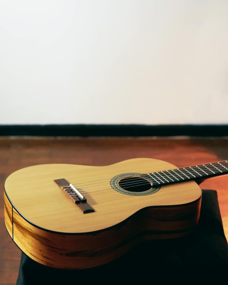 Acoustic Guitar On Floor